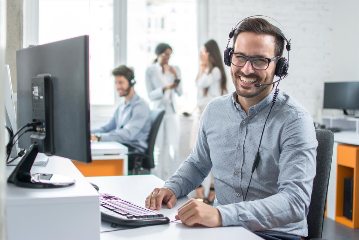 Male laughing on computer.PNG