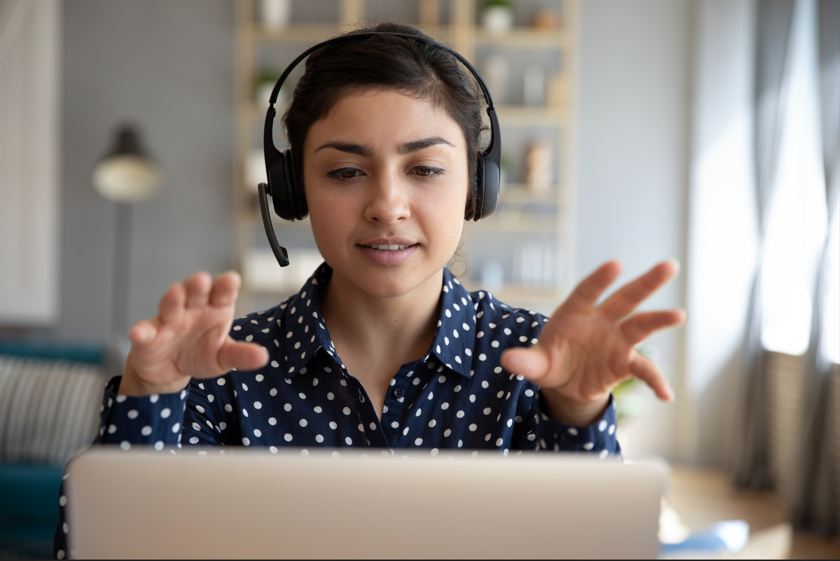 Woman on computer with hands.PNG